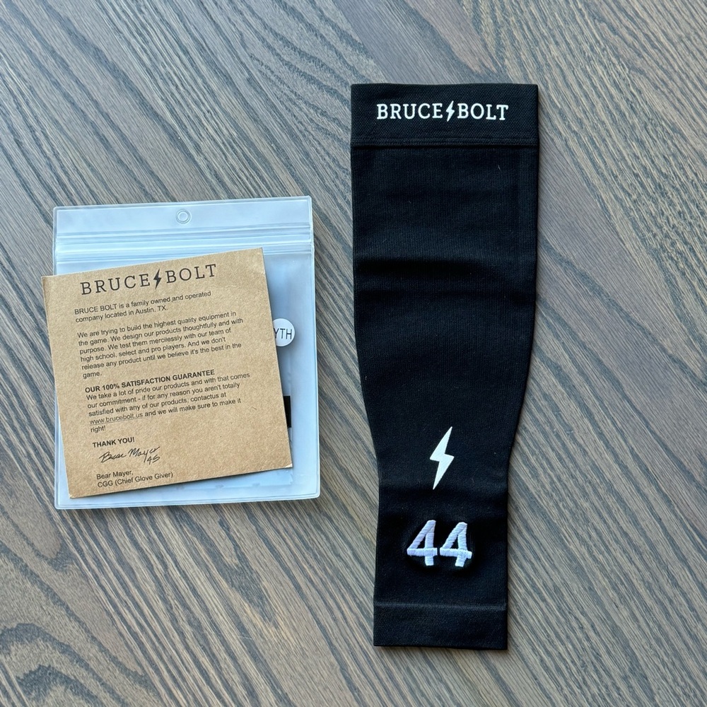 NEW! In Package - Bruce Bolt Compression Arm Sleeve. Color: Black Size: YTH